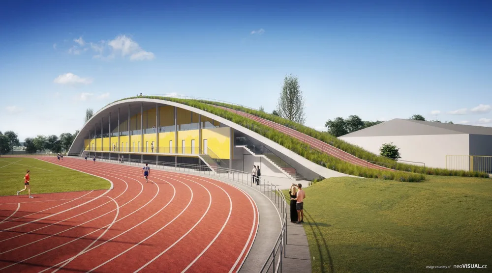 Na atletickém stadionu roste nová tribuna za 132 milionů. Unikátní střecha s náběhovým kopcem vylepší tréninky. Vizualizace od neoVisual.cz