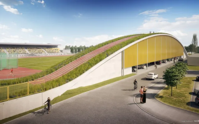 Na atletickém stadionu roste nová tribuna za 132 milionů. Unikátní střecha s náběhovým kopcem vylepší tréninky. Vizualizace od neoVisual.cz