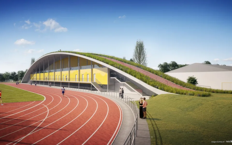 Na atletickém stadionu roste nová tribuna za 132 milionů. Unikátní střecha s náběhovým kopcem vylepší tréninky. Vizualizace od neoVisual.cz